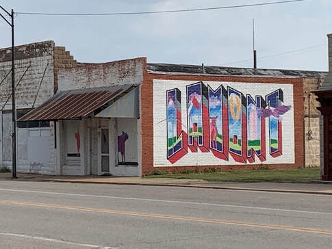 Downtown Lamont storefronts with the LAMONT mural